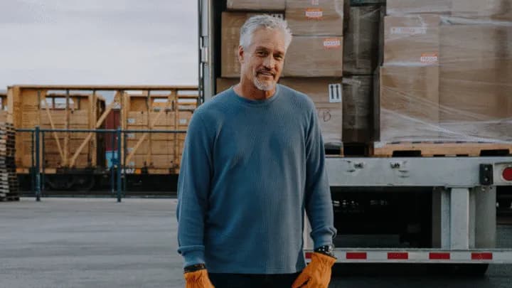 Carrier standing next to truck