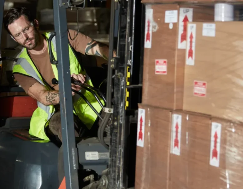 man driving forklift