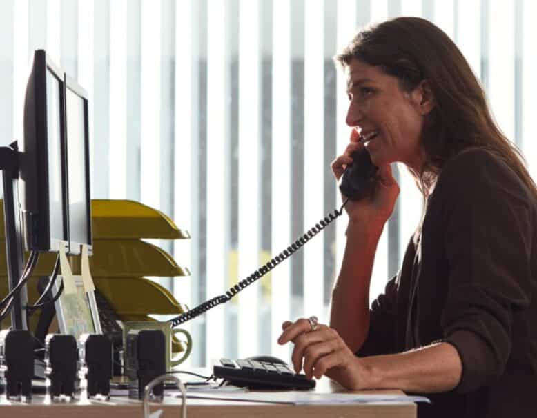 woman on phone at desk
