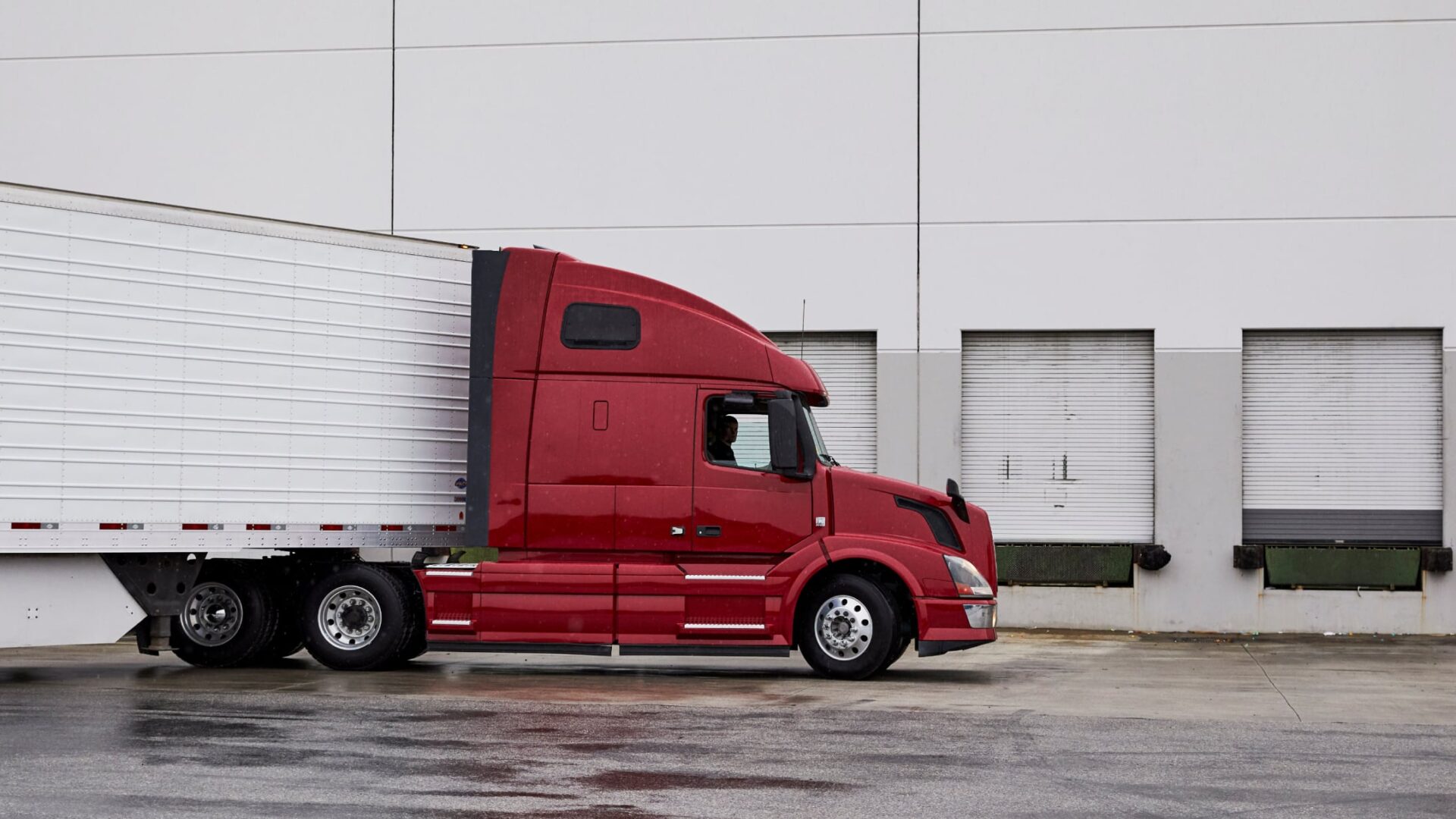 truck pulling up to loading dock