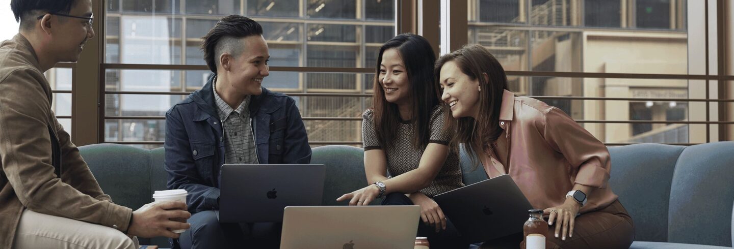 group of people looking at computers